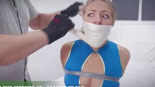 Bri - Blonde Flight Attendant bound gagged in bondage heavily tied with tape