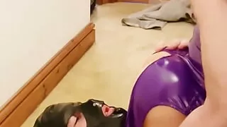 Self-facial crossdresser in latex mask