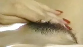Gorgeous Asian Girl Plays with Her Hairy Pussy on the Bed