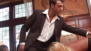 Photo shoot turns into a hardcore fivesome with two MILFS