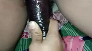 A big brinjal was inserted into sister-in-law's pussy.