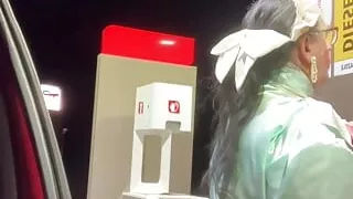 In a green and pink maid outfit to go and fill up the car