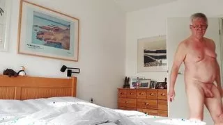 Bed making by naked senior