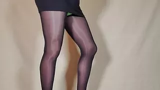 She teases in Her Black pantyhose, mini skirt and Hot high heels