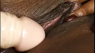 Group of black lesbians having sex with strap-on