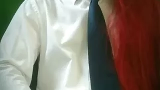 The crossdresser is playing with his dick.