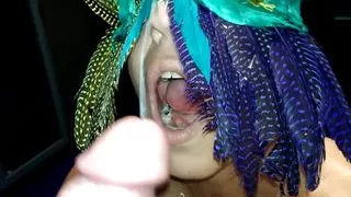 MILF with feathered mask sucks and takes HUGE cumshot on face