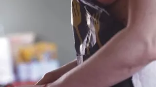 Cinematic film in which the husband films his wife undressed in the kitchen, behind the scenes