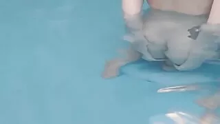 Riding a dildo in the pool