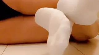 She's wearing socks and foot worship