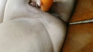 Carrot masturbating pussy leads to creamy mess and orgasm