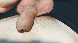 The guy plays with his balls and dick