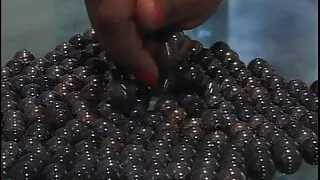 Impressive ebony babe with great curves deepthroats a large cock and gets fucked in bed