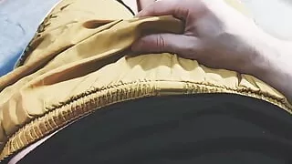 The guy in yellow shorts is entertaining himself