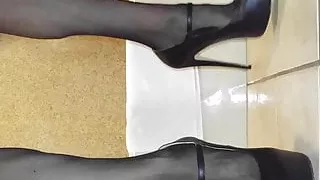 Man in heels in hotel