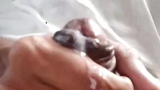 A boy cumming and massaging his big black dick , waiting for any beautiful pussy