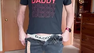 Daddy strips to his jock,  butt plug and starts playing