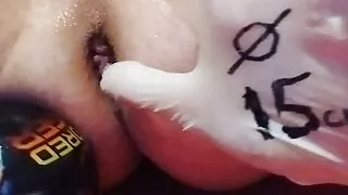 I insert the ball into my asshole and pump it up to 15 centimeters in diameter. Then I shoot the ball