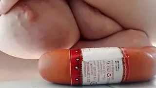 A sausage between the tits