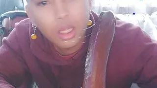 Latino wastes no time deep throating 12 inch black dildo !!