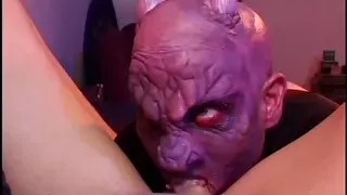 Masked man is on his knees eating out her pussy