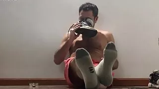 Playing with sneakers and smoking