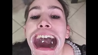 French maid tries to swallow her own piss through lip retractor