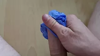 Pampered my cock with a latex glove.