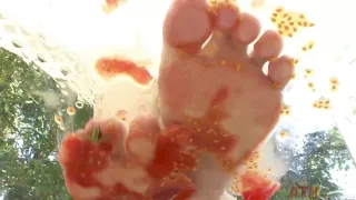 Brunette teen squishes vegetables outdoor