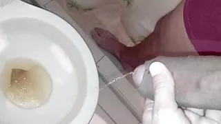 I helped my stepbrother pee and gave him a succulent blowjob until he cummed