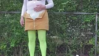 Gay crossdress tease, outdoors ground humping in pantyhose, black bra, miniskirt.