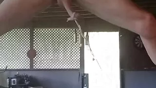 Outside stretching my cock with weights