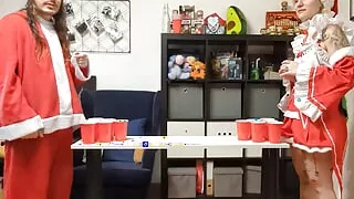 A tattooed woman is giving her boyfriend a nice Christmas blowjob