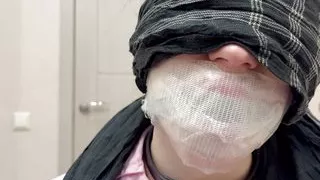 Tape tied to chair, ball gagged