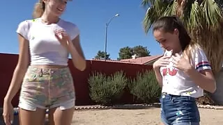 Three players in a strip version of the volleyball game