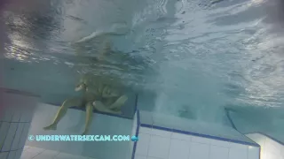 Sporty Couple Regenerating On An Underwater Bench