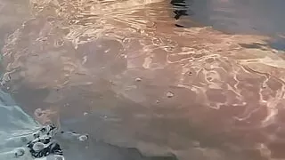 Hotwife and cub are in the hottub naked and rubbing cock