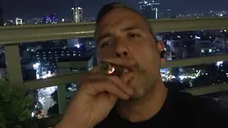 Uncut daddy smokes cigar and jerks on balcony PREVIEW