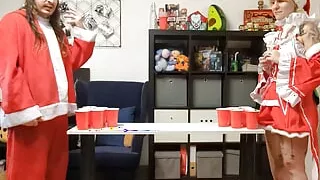 Blonde with big body tattoos playing strip games in a Santa outfit