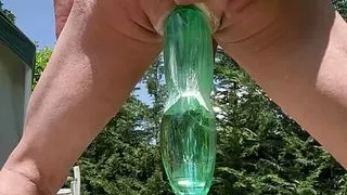 Bottle in ass outdoors