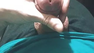 Guy in blue t-shirt jerking off his cock sitting in chair