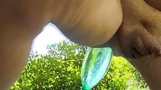 Sittin' on with bottle in my ass