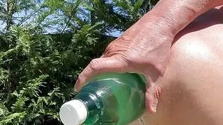 In the woods with a bottle in my ass