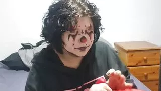 Clown girl Blowing up and popping huge balloon