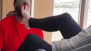Worshiping mature lady feet while neighbors watch on balcony