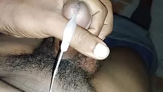 By shaking his penis, the desi boy made the penis release water.
