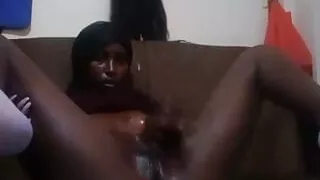 African girl takes cucumber