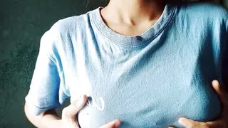 Lonely girl looking at her tits