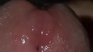 very close-up red head and fresh cock juice