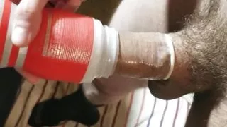 Fucking a Tenga cup with a condom, then filling the condom with my piss!